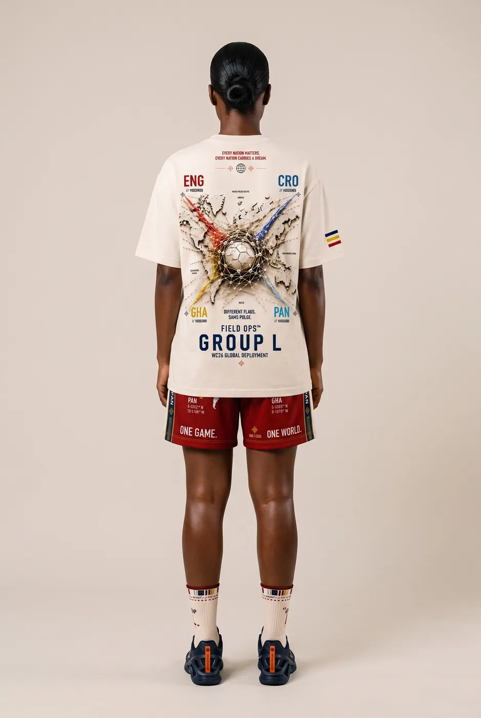 Group L tee worn on model, studio back.